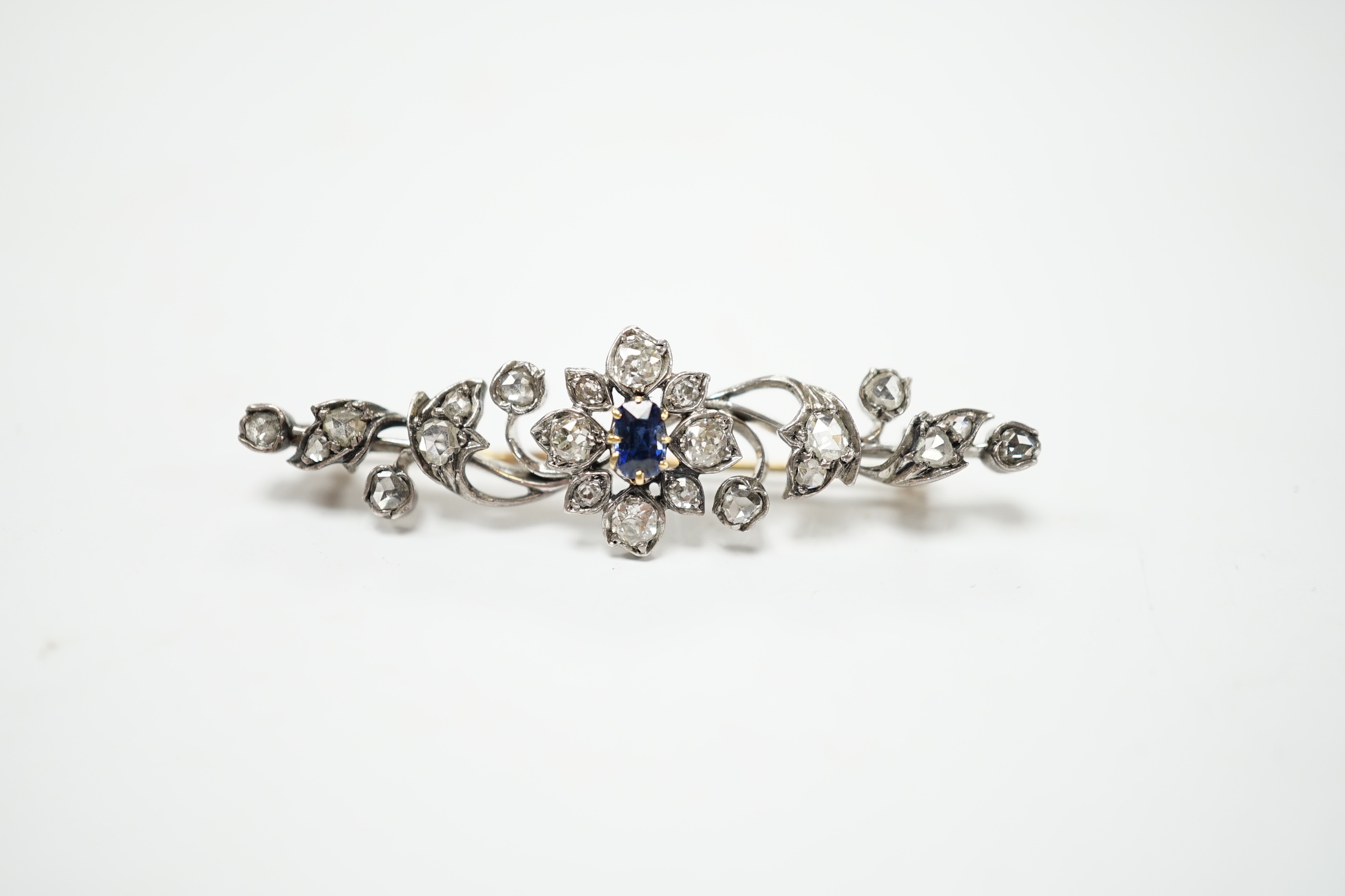 A late Victorian yellow and white metal, sapphire, old and rose cut diamond cluster set foliate brooch, 47mm, gross weight 4.3 grams.